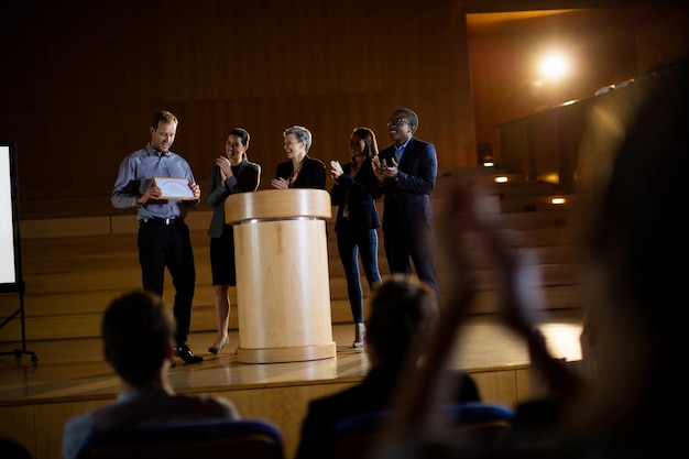 Free photo male business executive receiving award