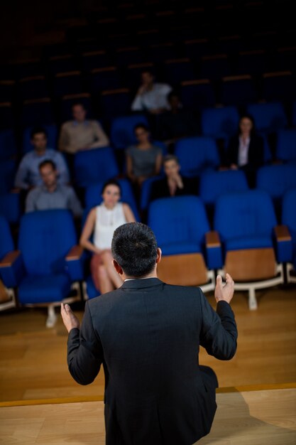 Male business executive talking to colleagues