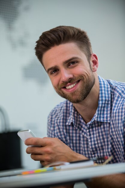 Male business executive using mobile phone