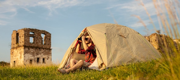 male camping in tent over night