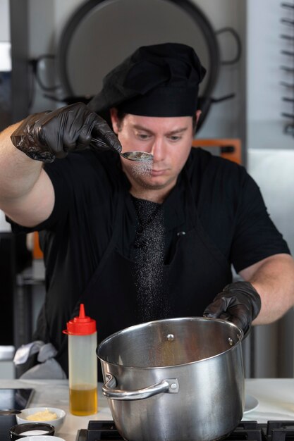 Male chef in kitchen cooking