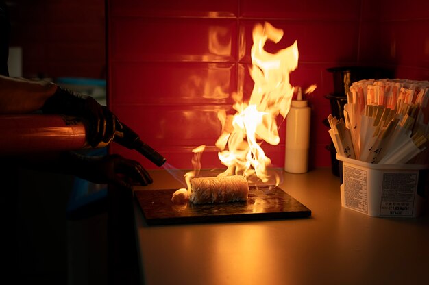 Male chef preparing a sushi order for a takeaway