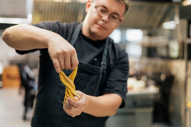 Male chef with pasta dough