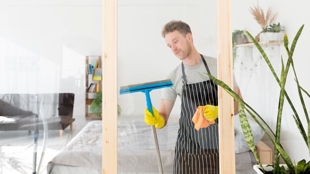 Male cleaning window