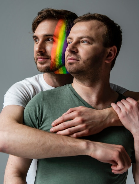 Free photo male couple with rainbow symbol