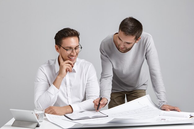 Male coworkers doing paperwork