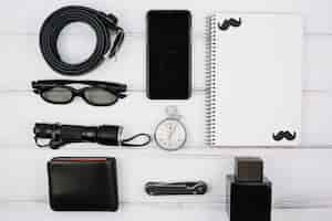 Free photo male devices and accessories on desk