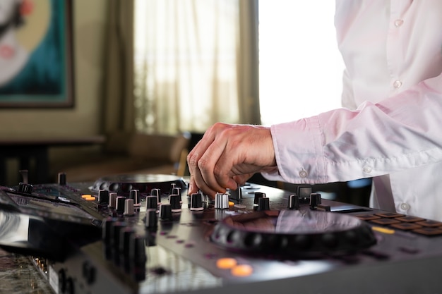 Male dj at the party in charge of the music entertainment