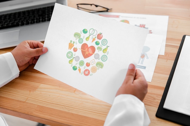 Male doctor hands holding a colorful diagram