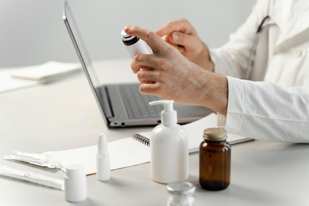 Male doctor at his desk with some medicine