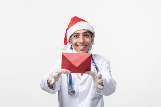 Male doctor holding red envelop covid health virus