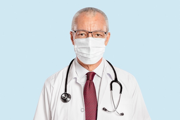 Free photo male doctor with a face mask portrait