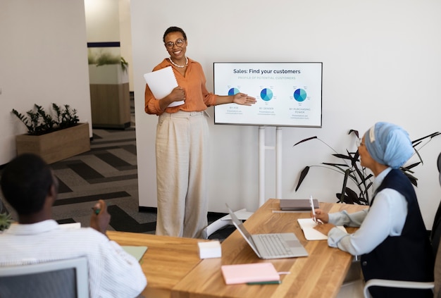 Male employee participating in training session at his new office job