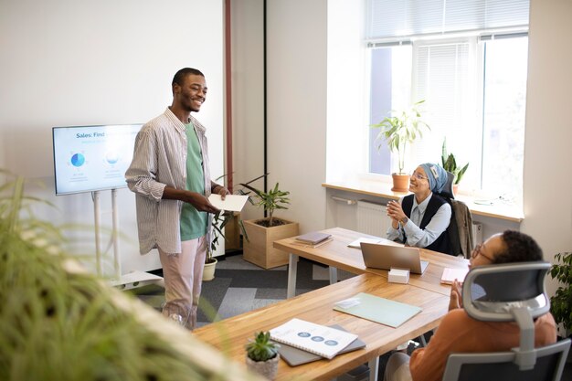 Male employee participating in training session at his new office job