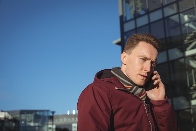 Male executive talking on mobile phone