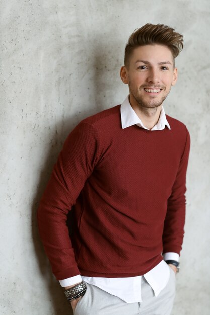 Male fashion on wooden floor, young man posing