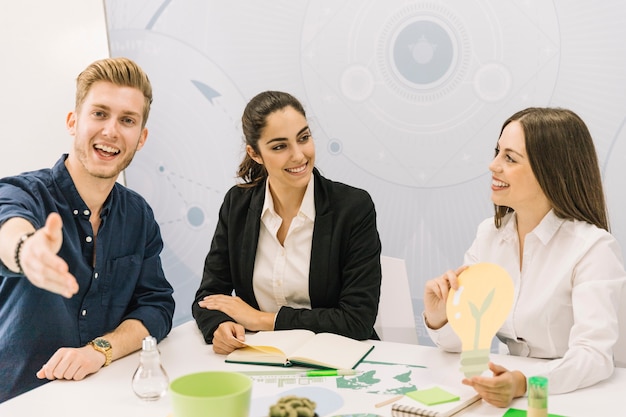 Male and female businesspeople with light bulb icon