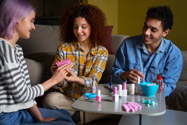 Male and female friends getting a manicure together