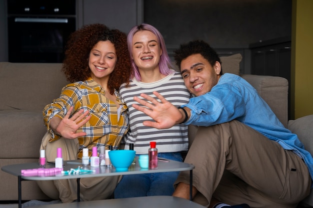 Free photo male and female friends getting a manicure together