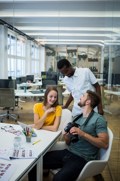 Male and female graphic designers interacting with each other