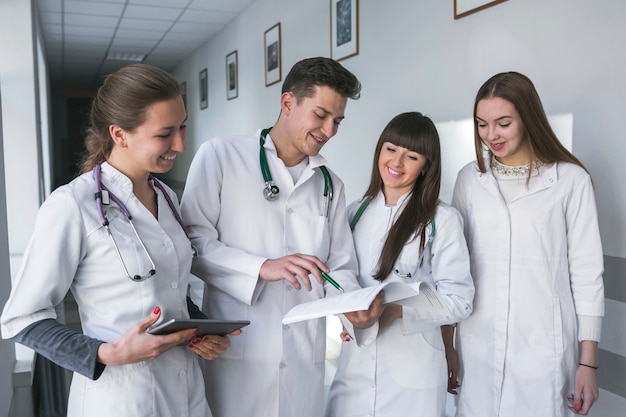 Male and female medics with papers