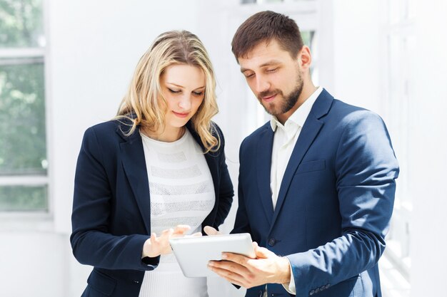 Male and female office workers.