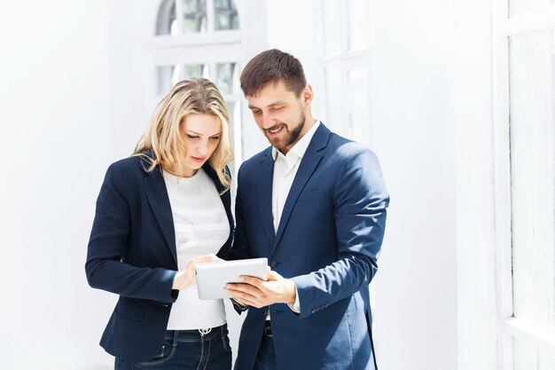 Male and female office workers.