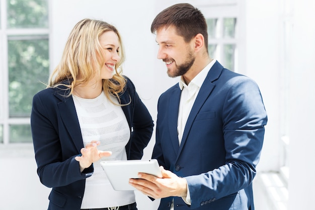 Male and female office workers.