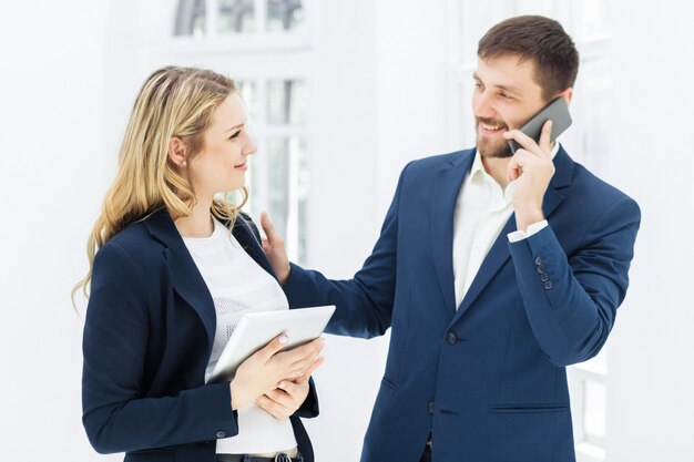 Male and female office workers.