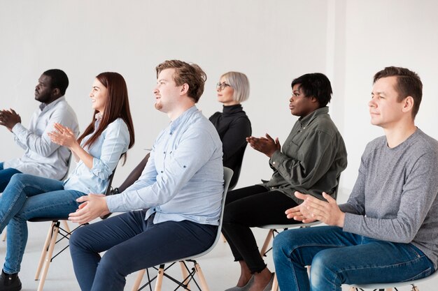 Male and female patients applauding