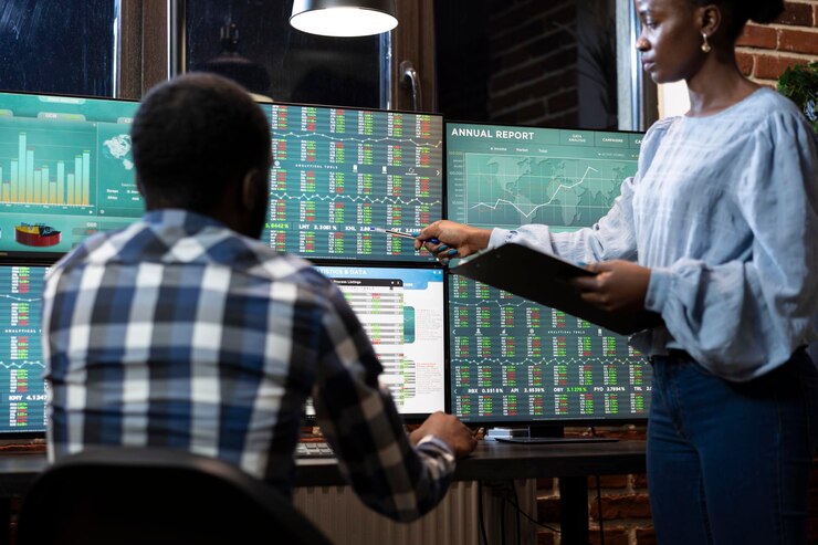 Free Photo male and female traders review stock data