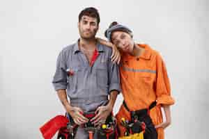 Free photo male and female workers wearing work clothes
