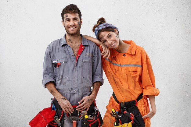 Male and female workers wearing work clothes