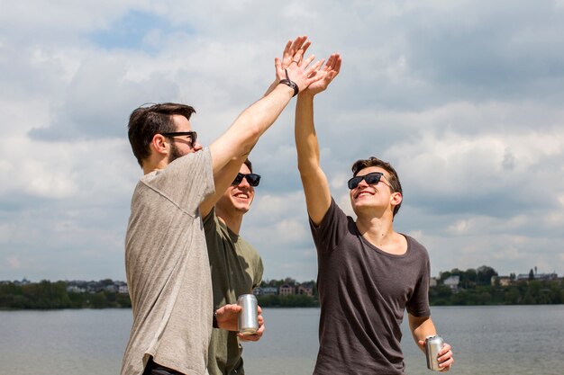 Male friends giving high five 
