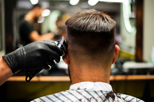 Free photo male getting his hair cut