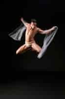 Free photo male gymnast jumping in air