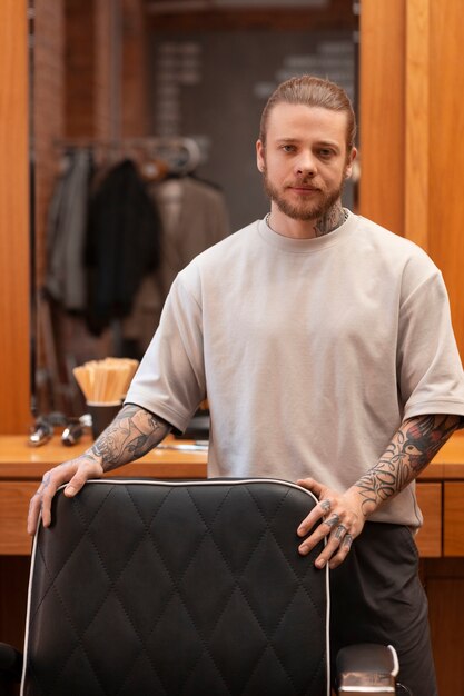 Male hairdresser posing at the salon