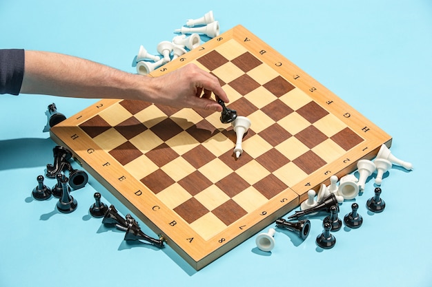 Free photo male hand and chess board, game concept.