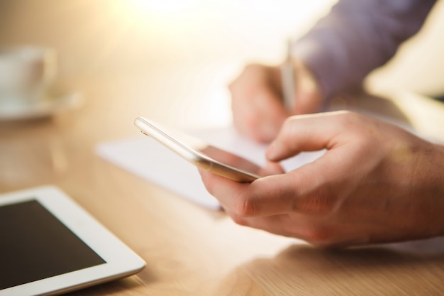 male hand holding a phone