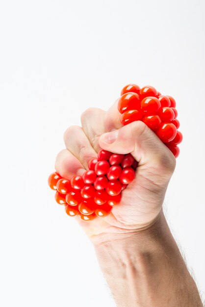 Male hand squeezing stress ball