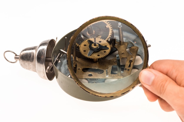 The male hand with magnifier and clockwork