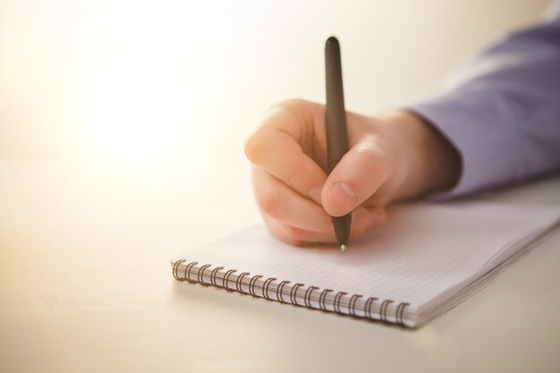 male hand with a pen