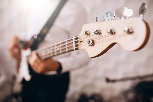 Male hands close up playing the guitar