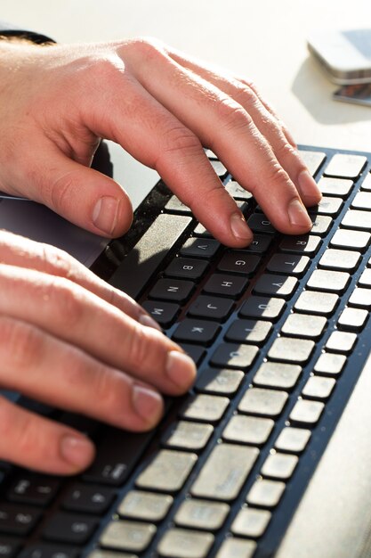 Male hands in keyboard