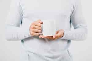 Free photo male hands with a coffee mug