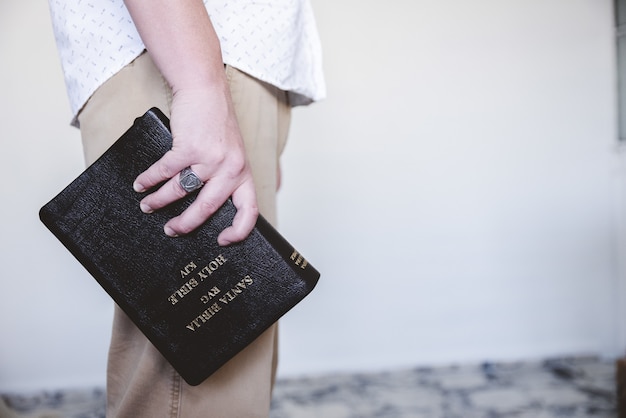 Free photo male holding the bible