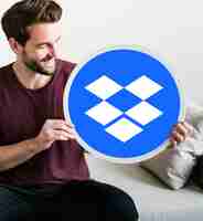 Free photo male holding a dropbox logo