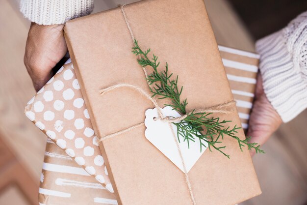 Male holding present boxes in wraps