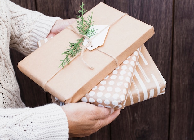 Free photo male holding present boxes