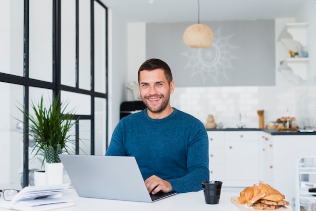 Male at home using laptop mock-up